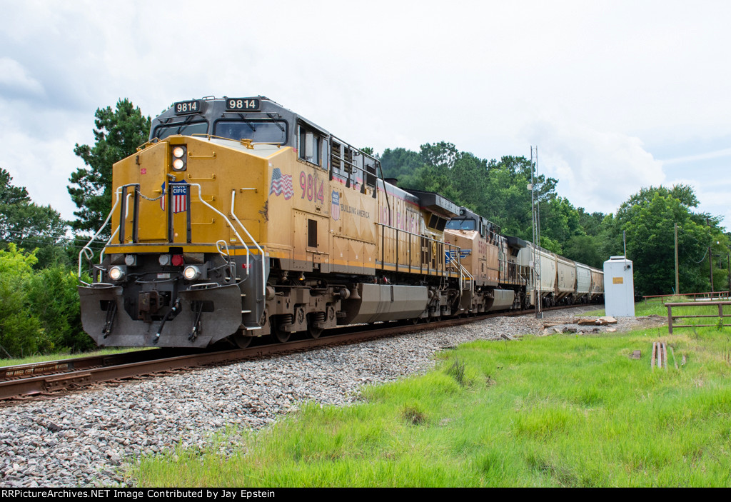 UP 9814 leads a grain train east at Hallsville